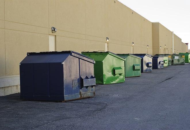 a row of construction dumpsters parked on a jobsite in Boswell, IN